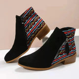 a pair of black boots with a colorful pattern